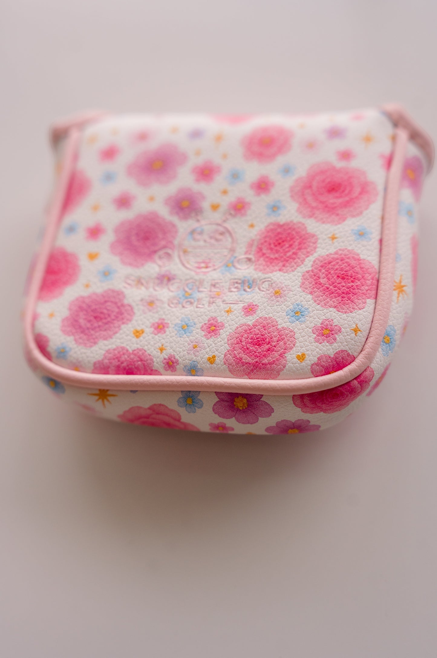 Snuggle Bug Golf Starlight Bloom mallet putter headcover in white textured eco-leather with pink floral star pattern.