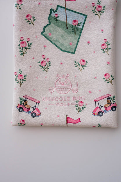 Snuggle Bug Golf Arizona Bloom drawstring pouch in white pebbled eco-leather with pink floral and golf cart print.