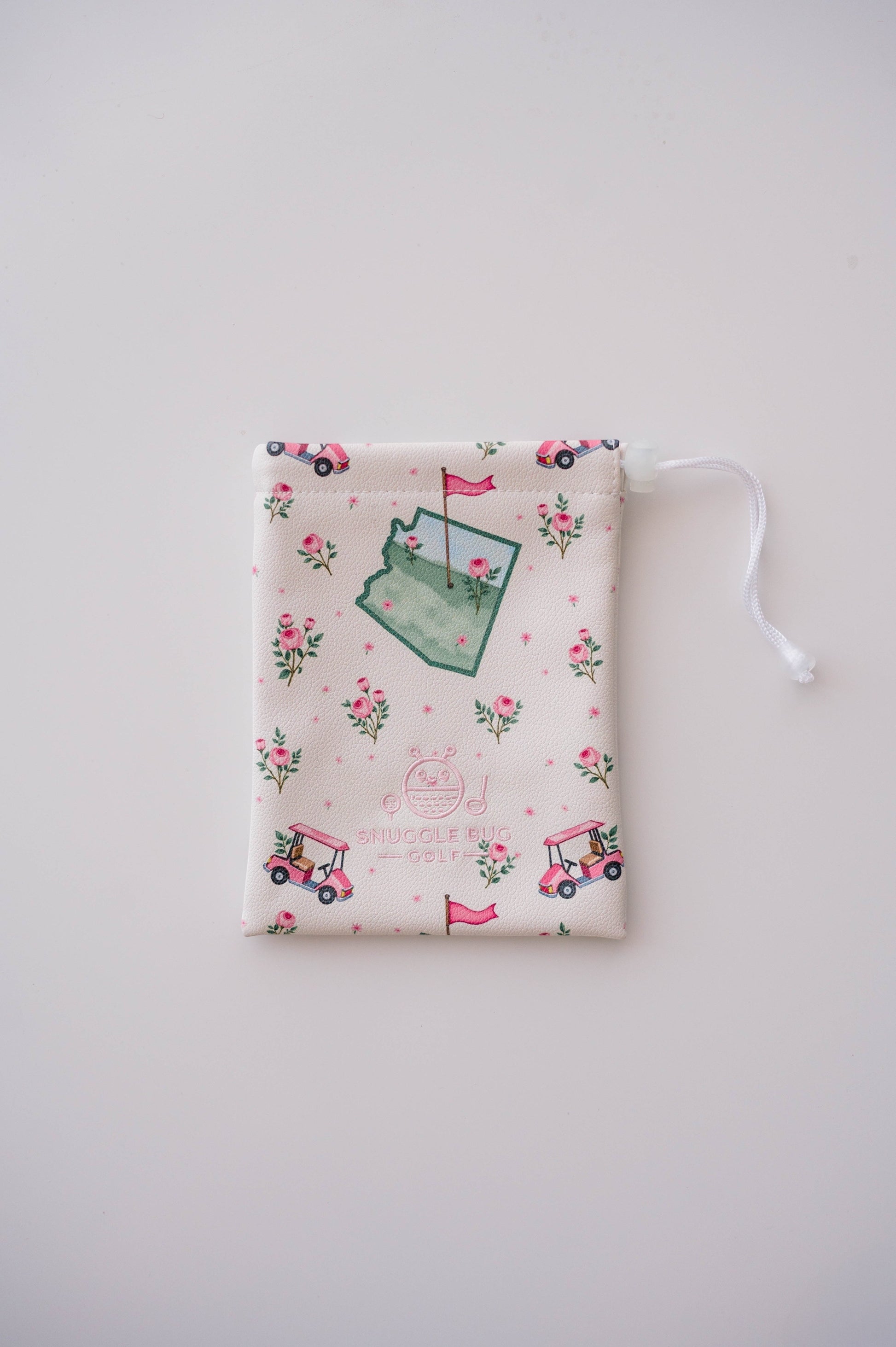 Snuggle Bug Golf Arizona Bloom drawstring pouch in cream eco-leather with cactus, golf cart, and rose print.