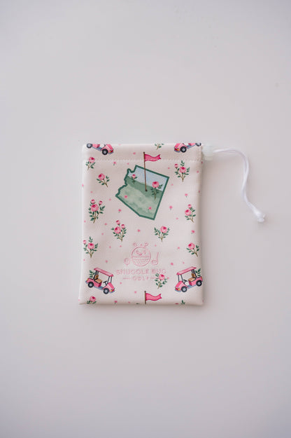 Snuggle Bug Golf Arizona Bloom drawstring pouch in cream eco-leather with cactus, golf cart, and rose print.