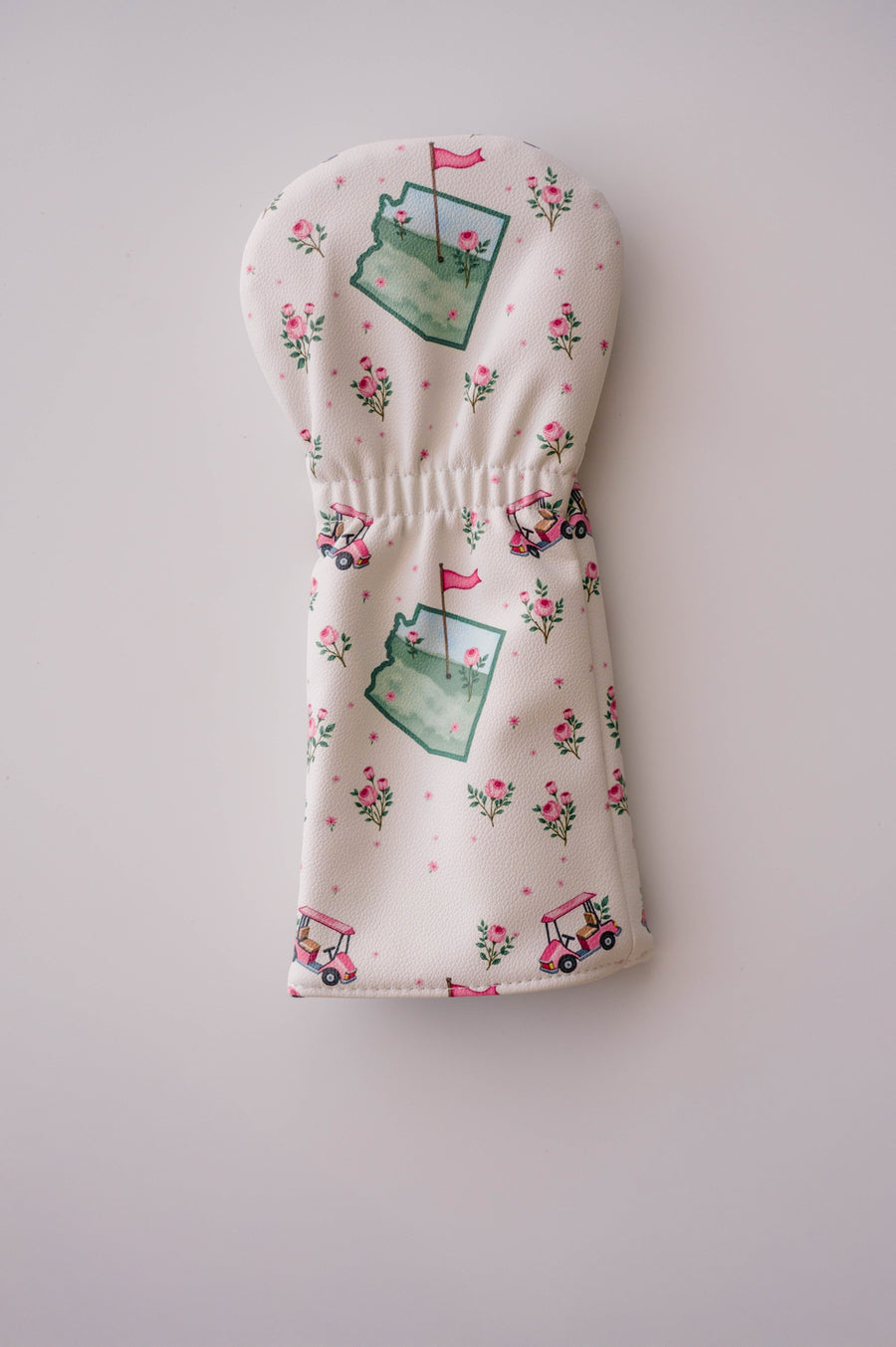 Snuggle Bug Golf Arizona Bloom driver headcover in cream eco-leather with pink golf carts and rose floral pattern.