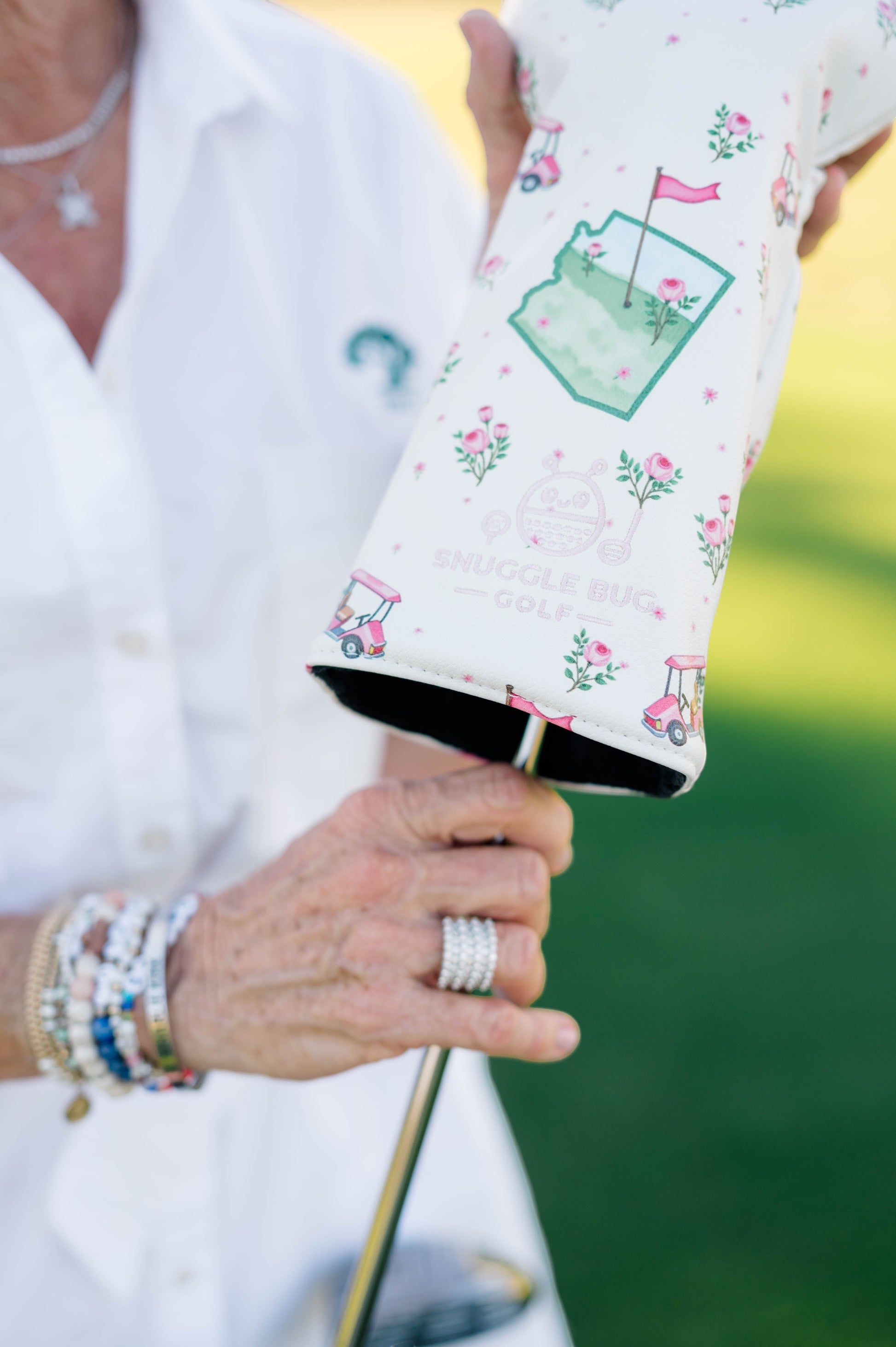 Snuggle Bug Golf Arizona Bloom driver headcover in cream eco-leather with pink golf cart and rose floral print.