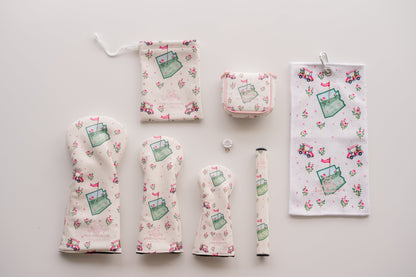 Snuggle Bug Golf Arizona Bloom collection featuring headcovers, golf towel, and accessories with desert rose print.