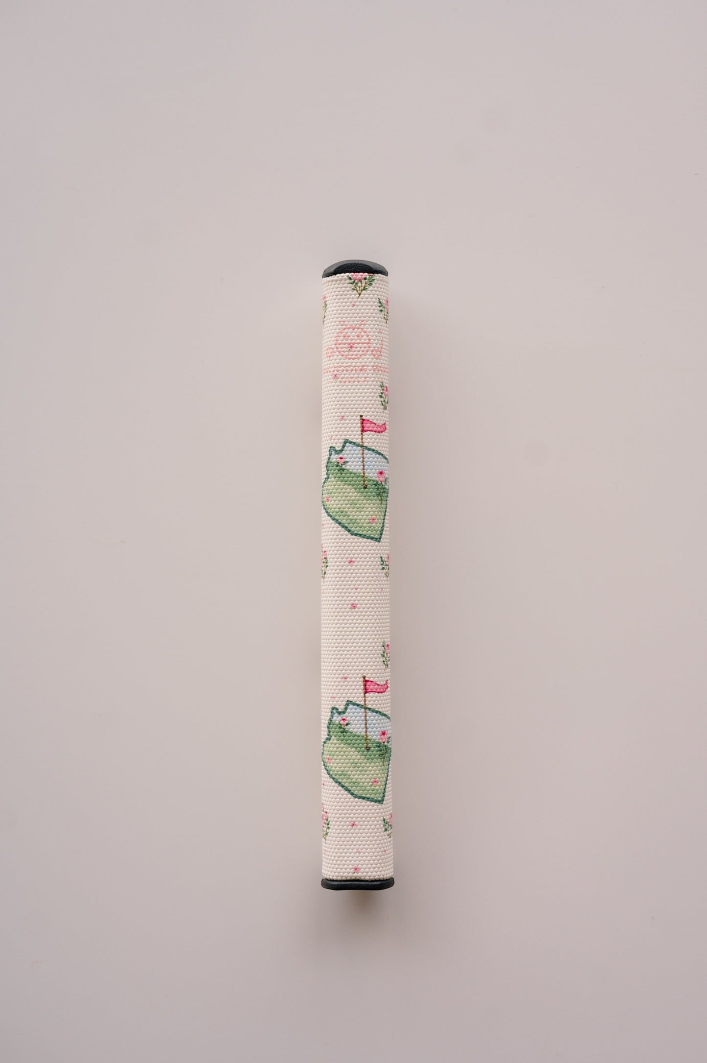 Snuggle Bug Golf Arizona Bloom putter grip featuring a floral print with pink blossoms and green golf course motifs.
