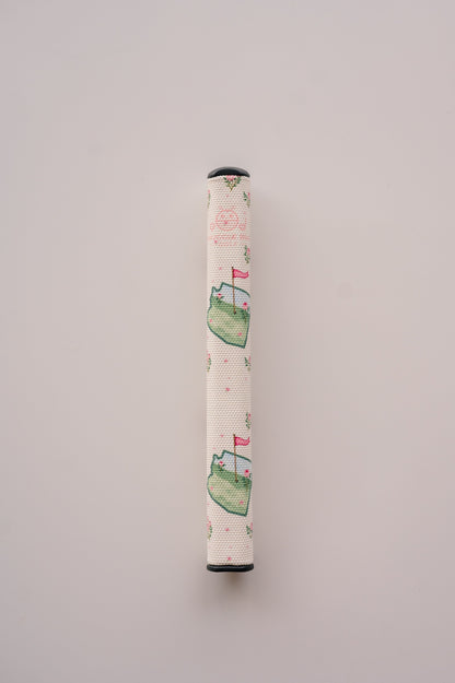 Snuggle Bug Golf Arizona Bloom putter grip featuring a floral print with pink blossoms and green golf course motifs.