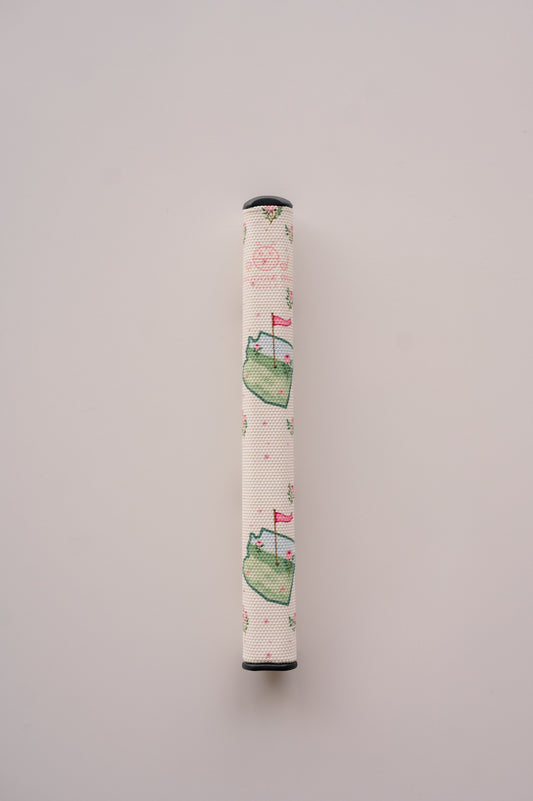 Snuggle Bug Golf Arizona Bloom putter grip featuring a floral print with pink blossoms and green golf course motifs.