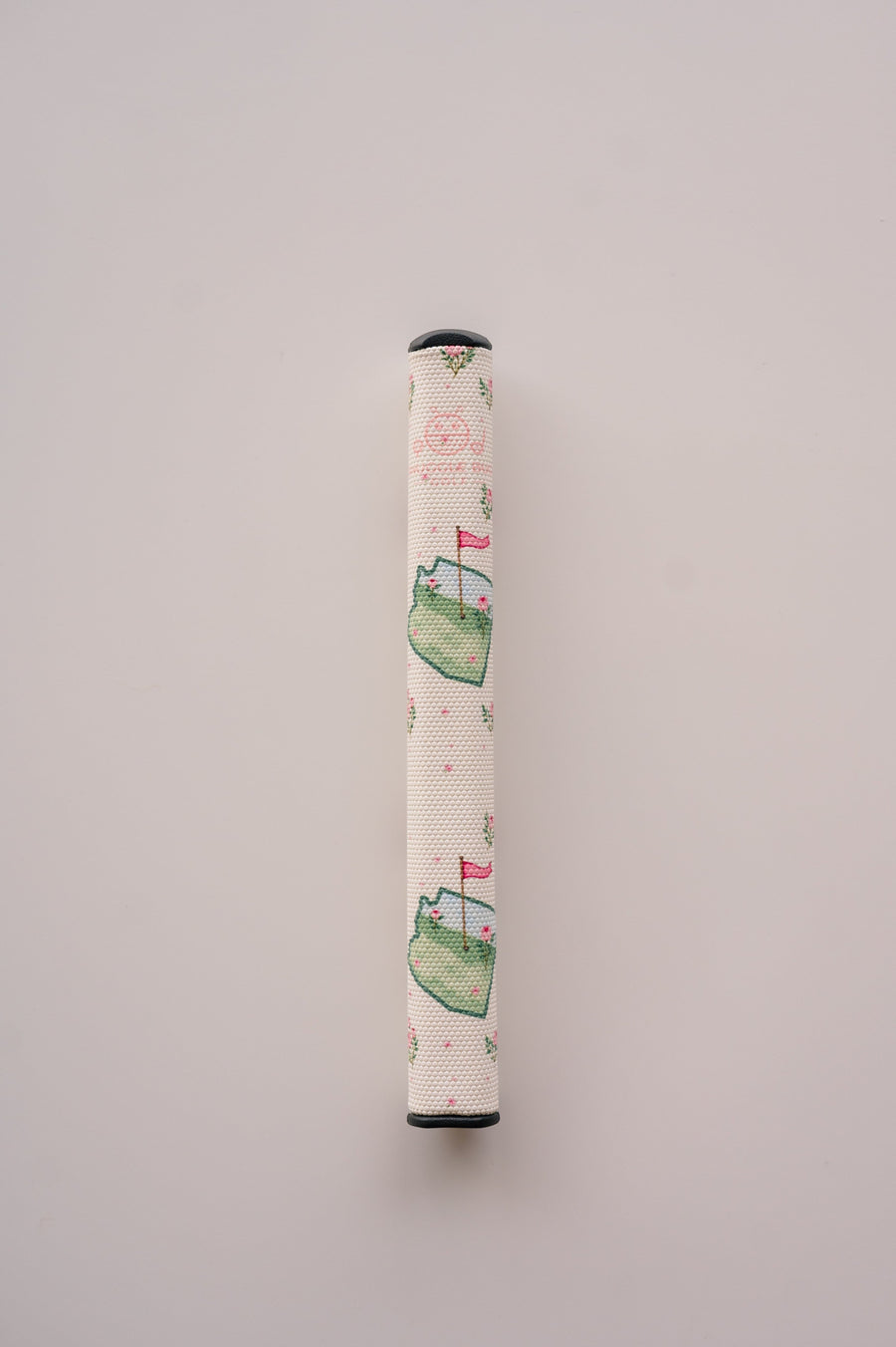 Snuggle Bug Golf Arizona Bloom putter grip featuring a floral print with pink blossoms and green golf course motifs.