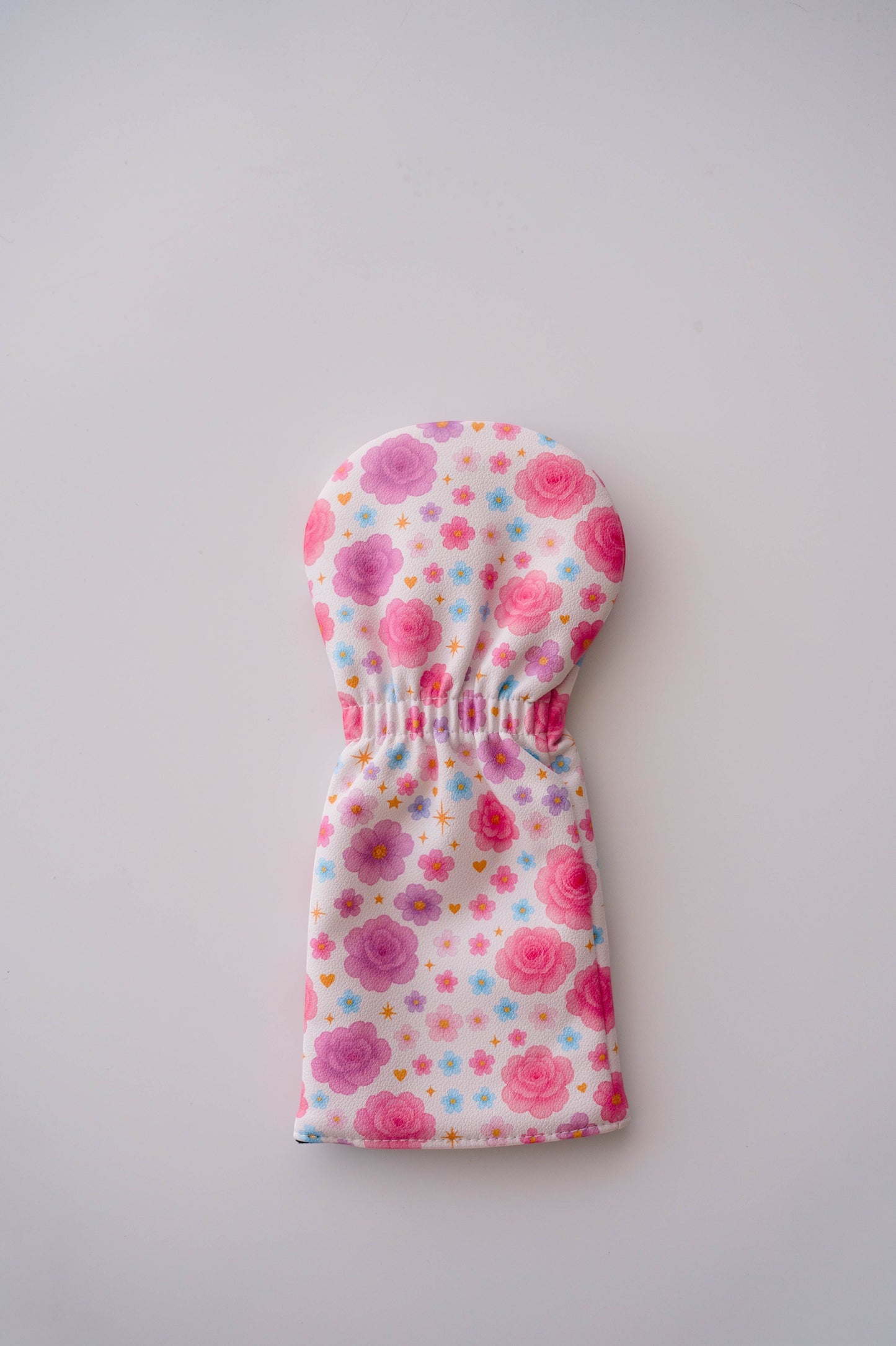 Snuggle Bug Golf Starlight Bloom driver head cover in textured eco-leather with pink floral and golden star pattern.