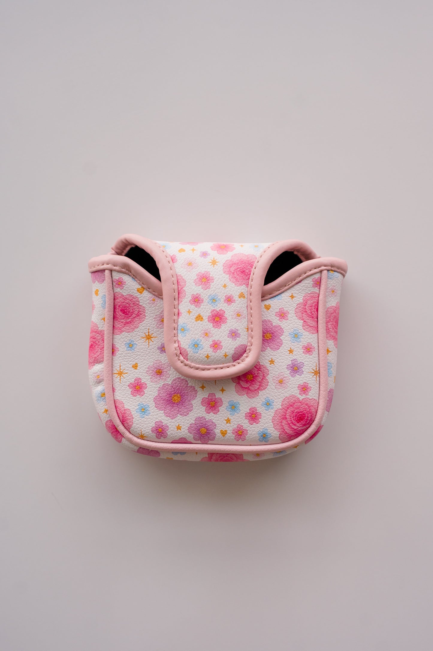 Snuggle Bug Golf mallet putter headcover in white eco-leather with a pastel floral, star, and heart print.
