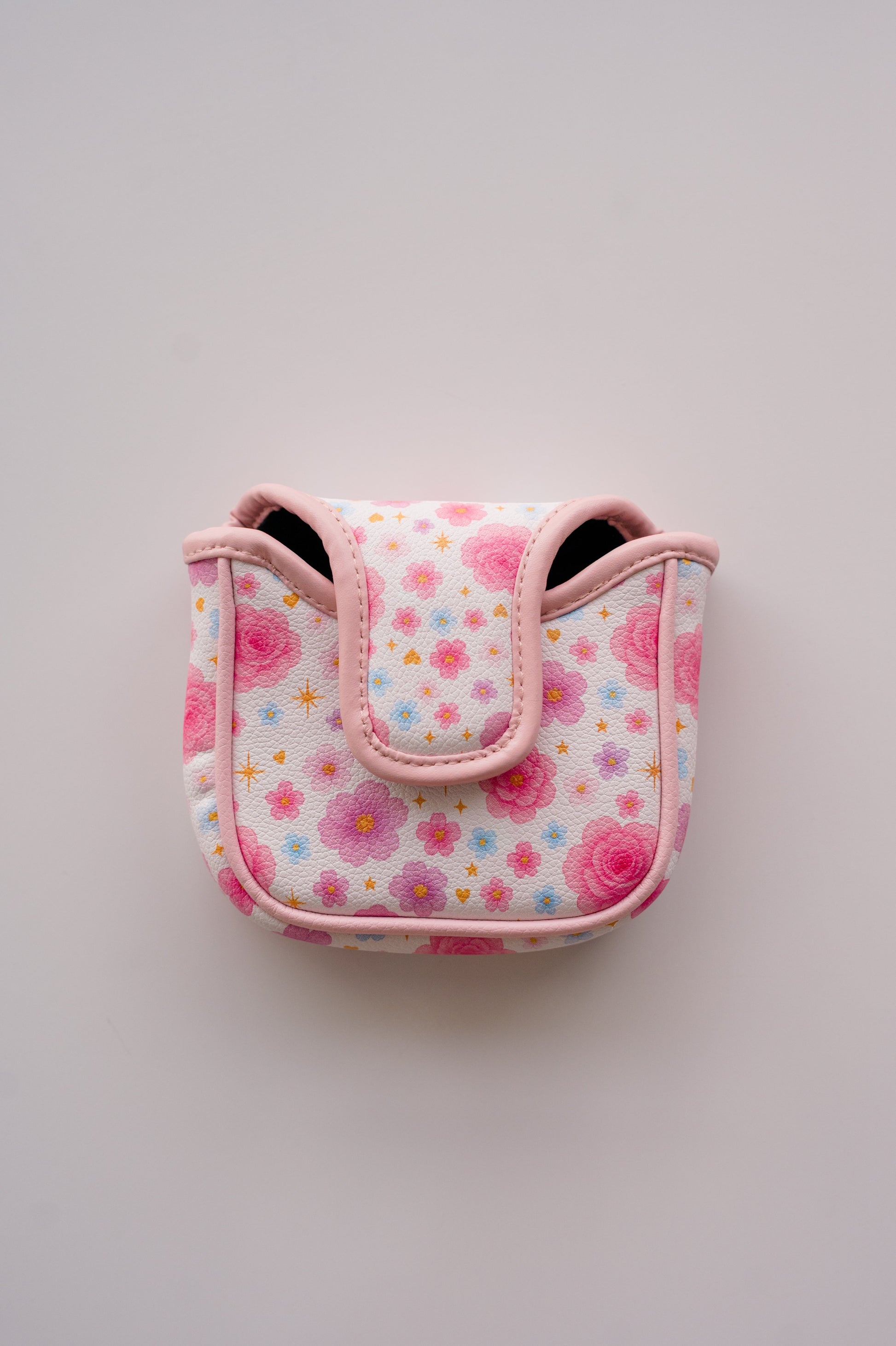 Snuggle Bug Golf mallet putter headcover in white eco-leather with a pastel floral, star, and heart print.
