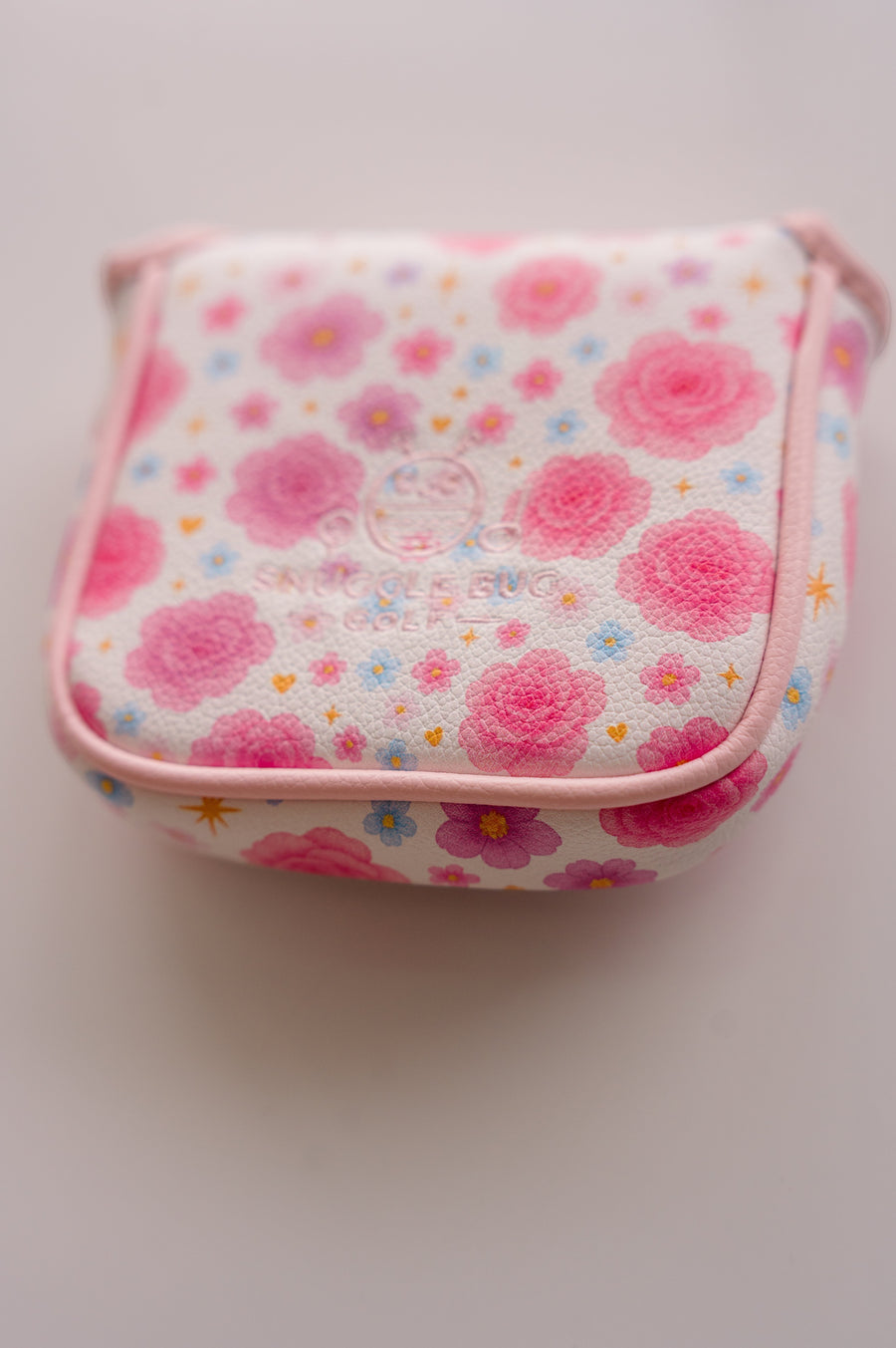 Snuggle Bug Golf Starlight Bloom mallet putter headcover in white textured eco-leather with pink floral star pattern.