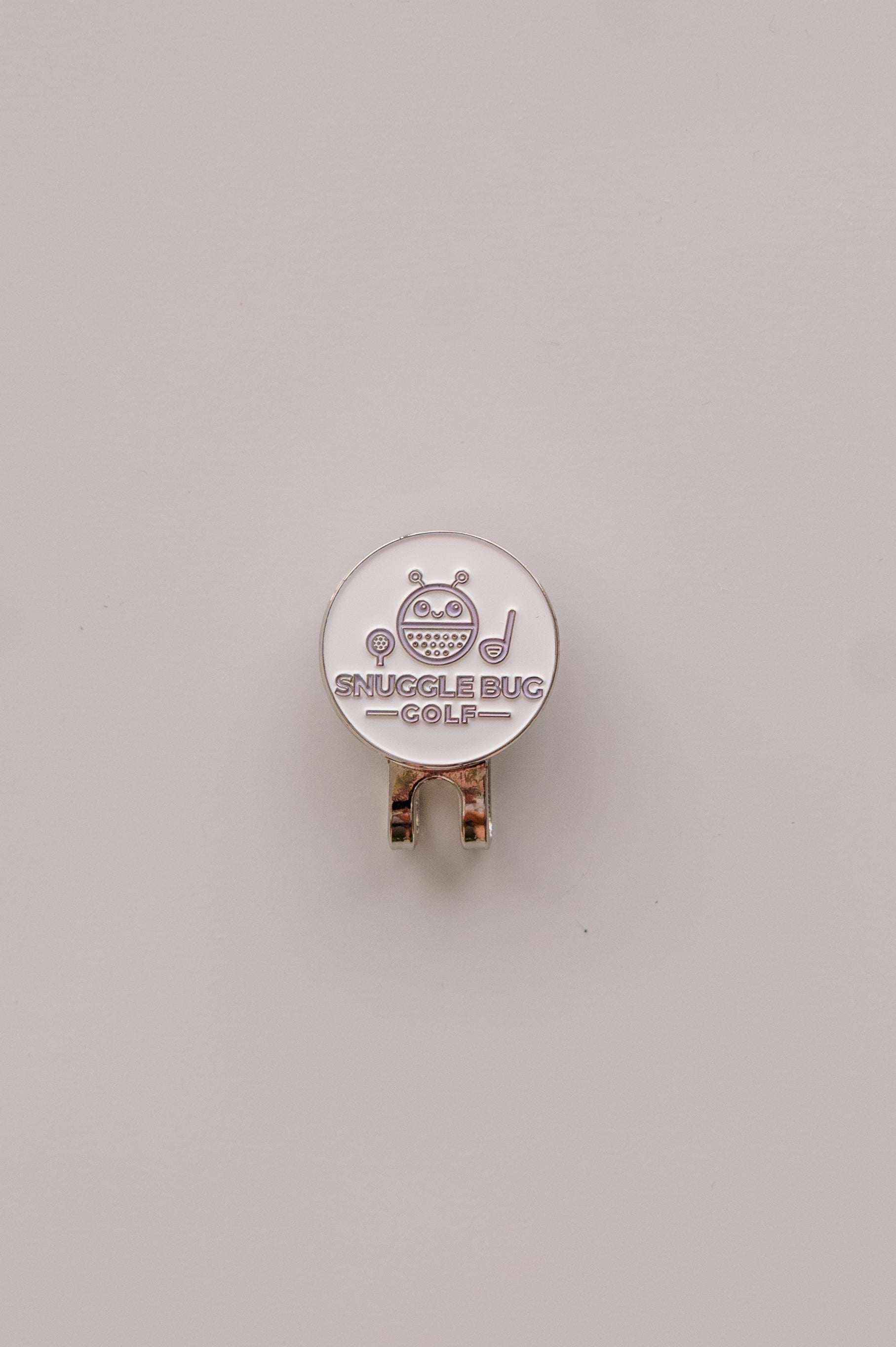 Snuggle Bug Golf hat clip with a white round ball marker featuring a cute bug character and golf club icon