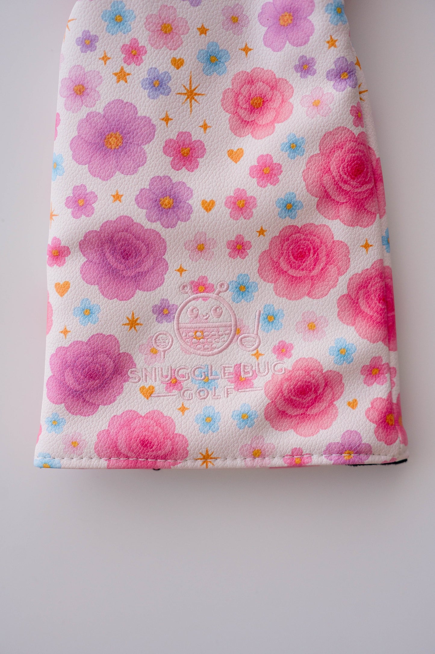 Snuggle Bug Golf Starlight Bloom driver head cover in white eco-leather with pink floral and golden star pattern.