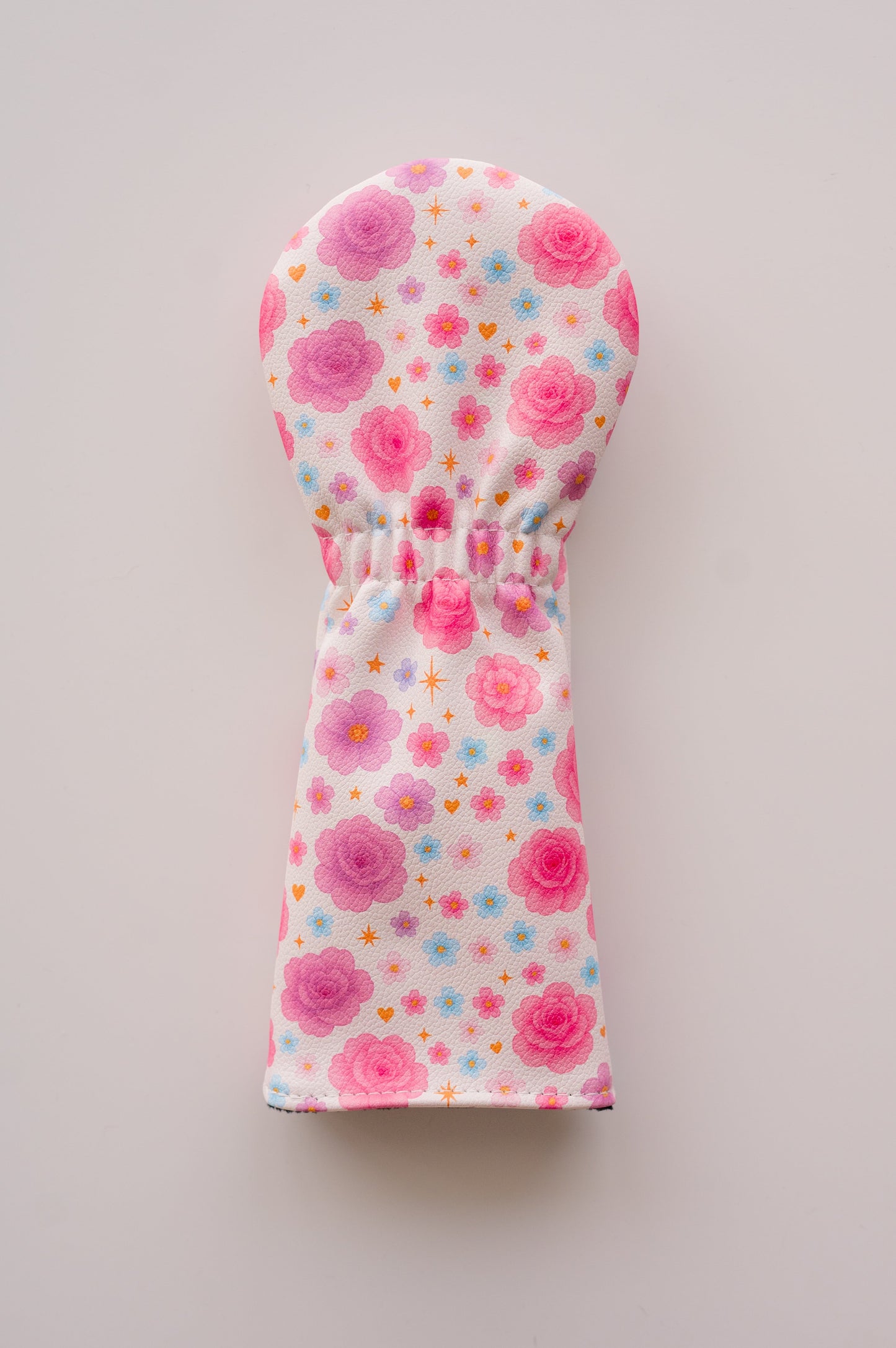 Snuggle Bug Golf Starlight Bloom fairway headcover in textured eco-leather with pink roses and golden stars pattern.