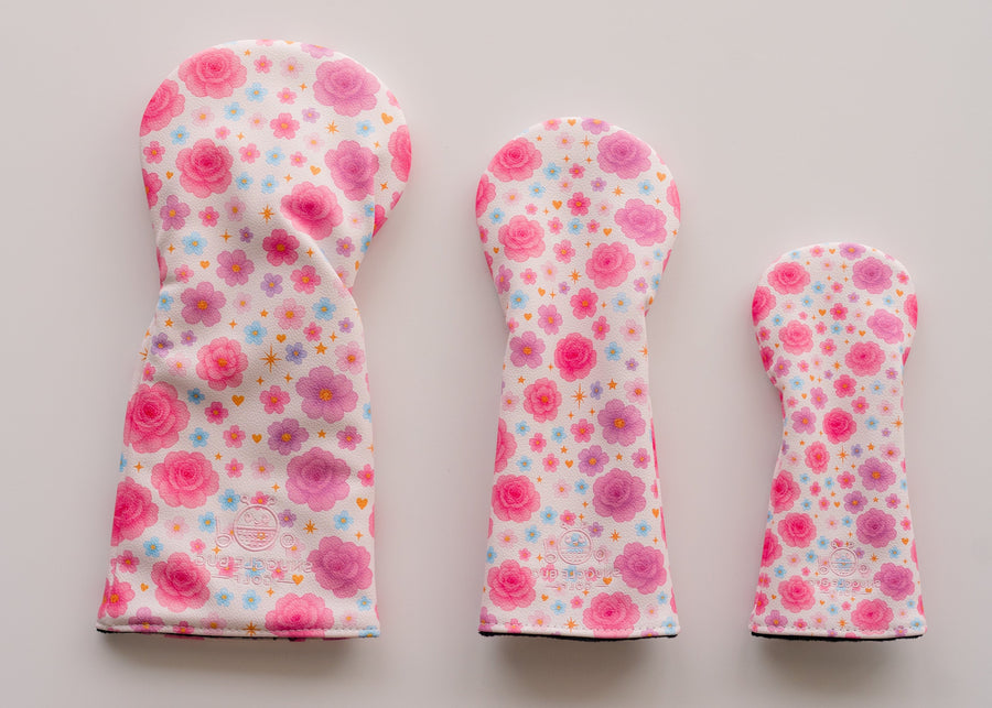 Snuggle Bug Golf Starlight Bloom fairway headcovers in pink and lavender floral print with gold stars on eco-leather.