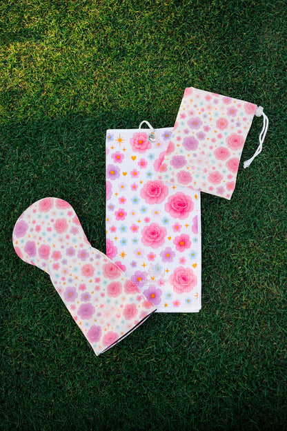 Snuggle Bug Golf Starlight Bloom driver head cover, golf towel, and pouch set with pink floral and star pattern.