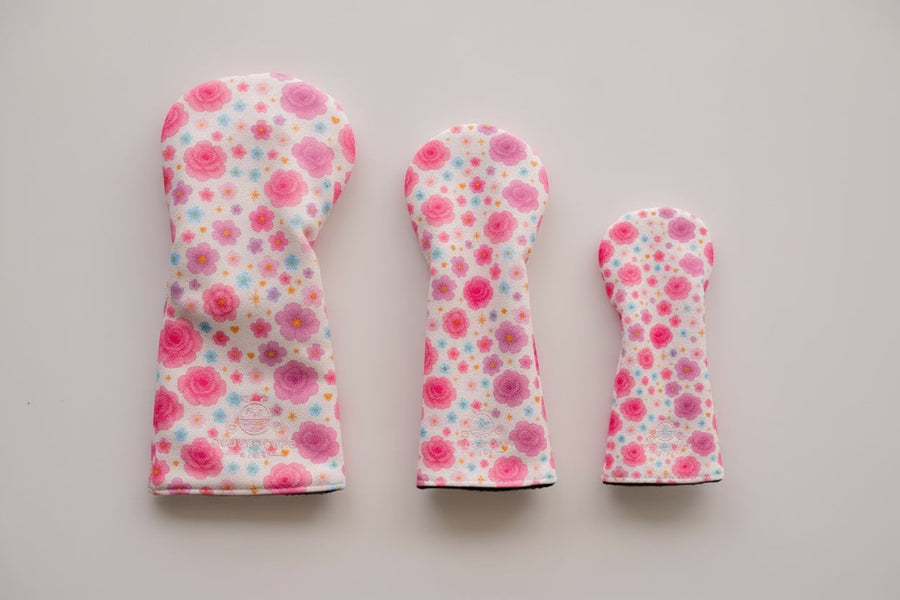 Snuggle Bug Golf Starlight Bloom 3-piece golf headcover set with pink and purple floral celestial pattern