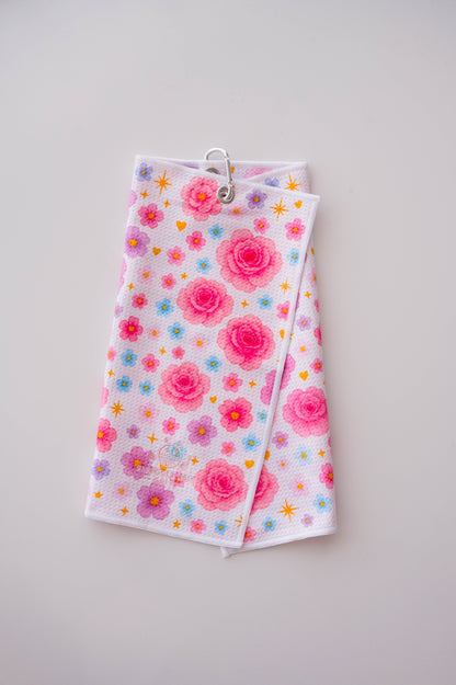 Snuggle Bug Golf Starlight Bloom waffle microfiber towel with pink roses, lavender flowers, and gold stars.