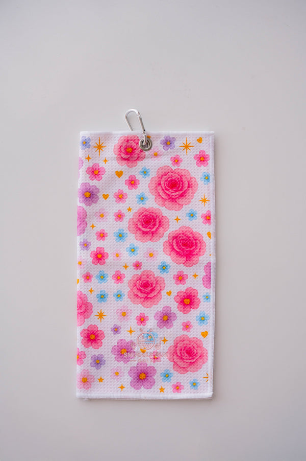 Snuggle Bug Golf Starlight Bloom waffle microfiber towel with pink roses, lavender flowers, and golden stars.