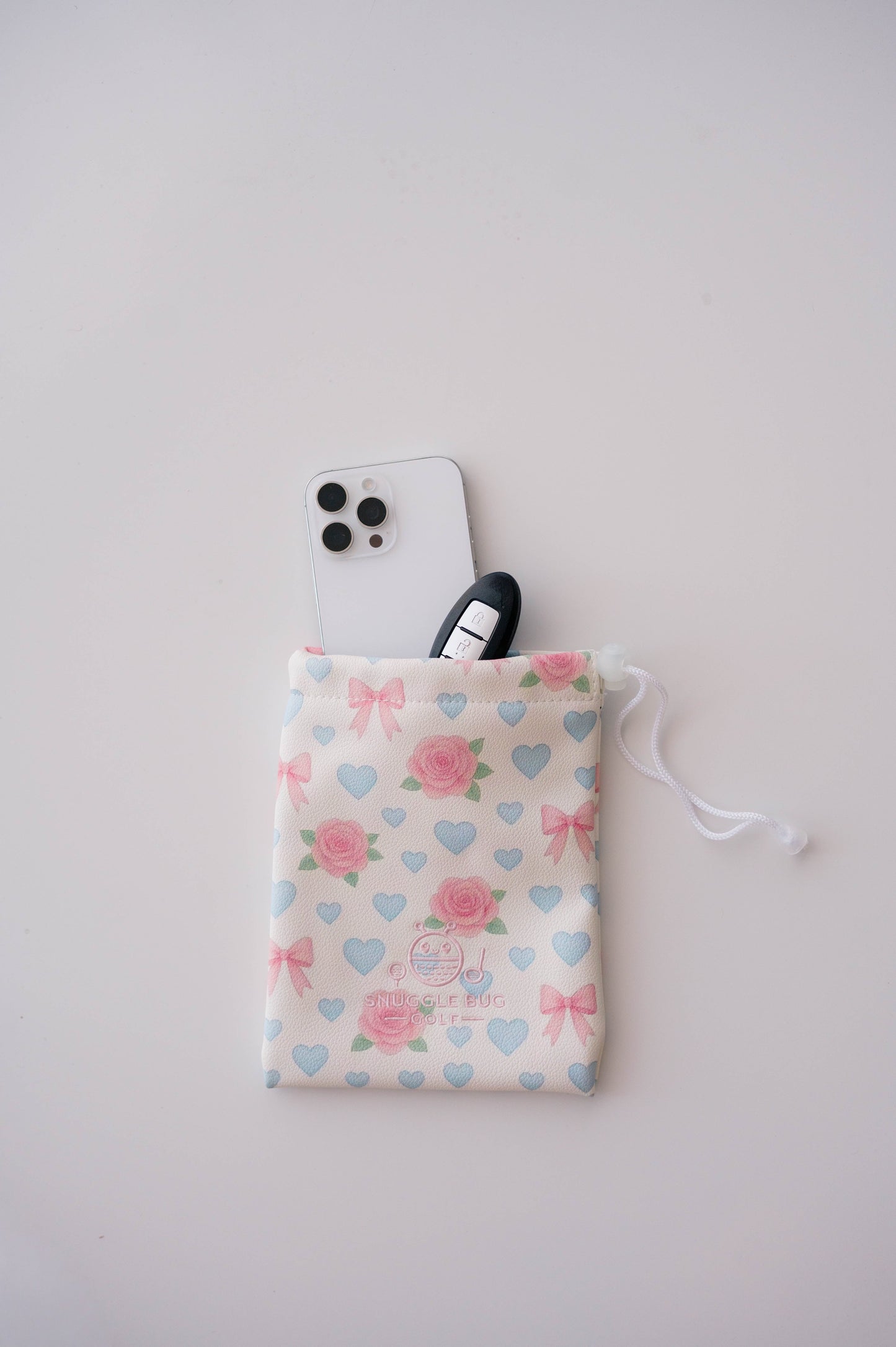 Snuggle Bug Golf Sweetheart Rose drawstring pouch in blush eco-leather with pink roses, blue hearts, and white bows.