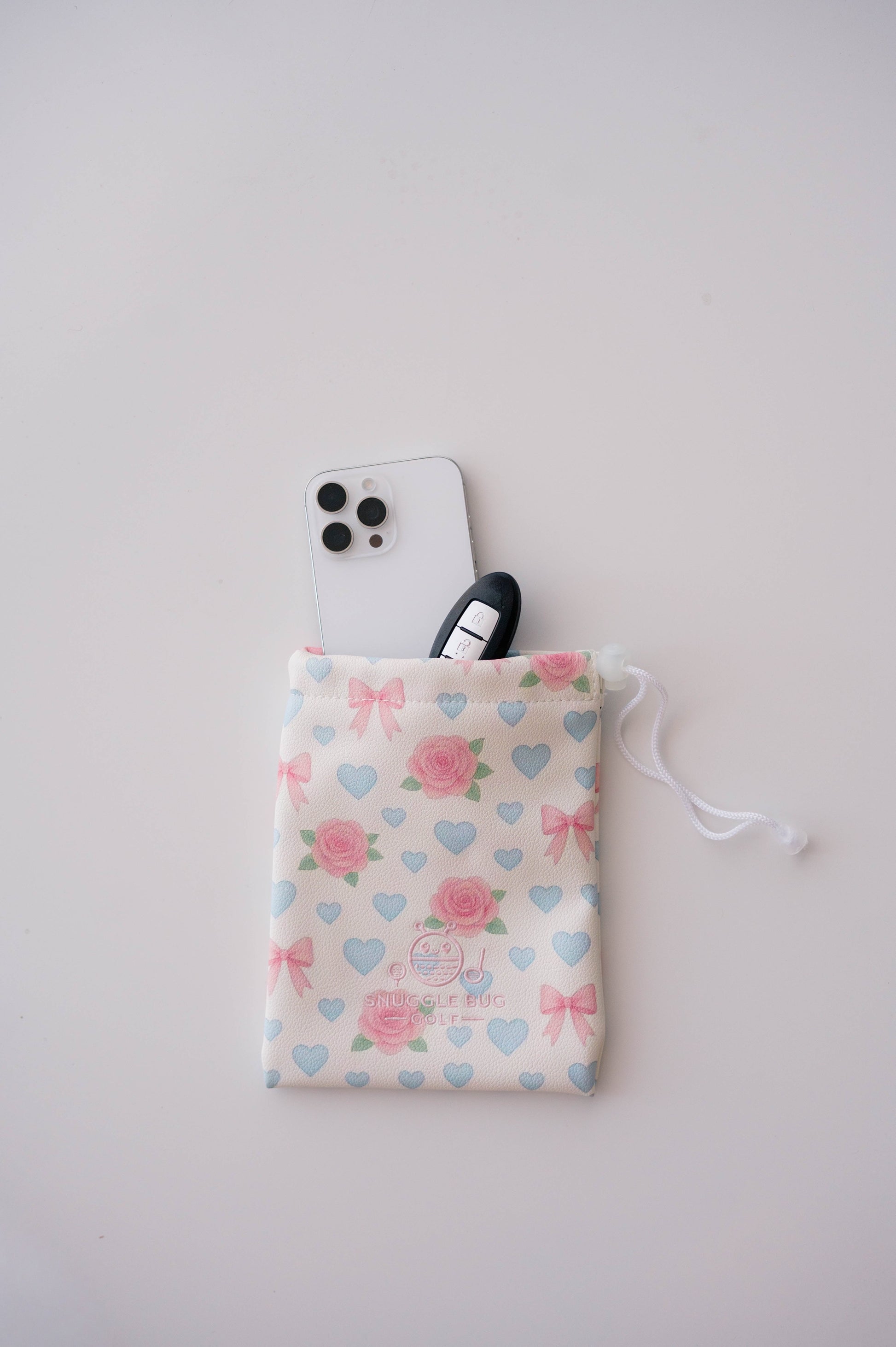 Snuggle Bug Golf Sweetheart Rose drawstring pouch in blush eco-leather with pink roses, blue hearts, and white bows.