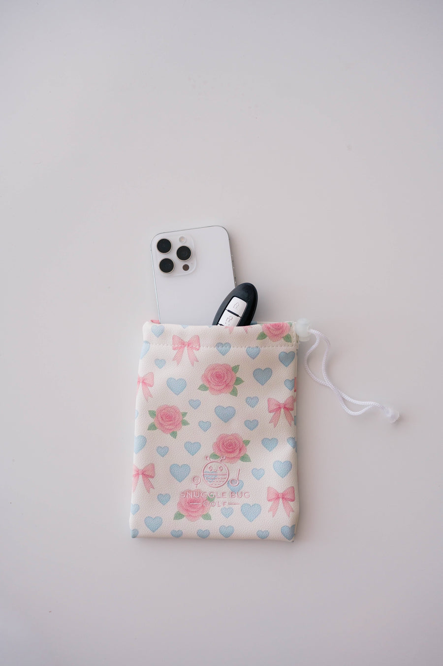 Snuggle Bug Golf Sweetheart Rose drawstring pouch in blush eco-leather with pink roses, blue hearts, and white bows.
