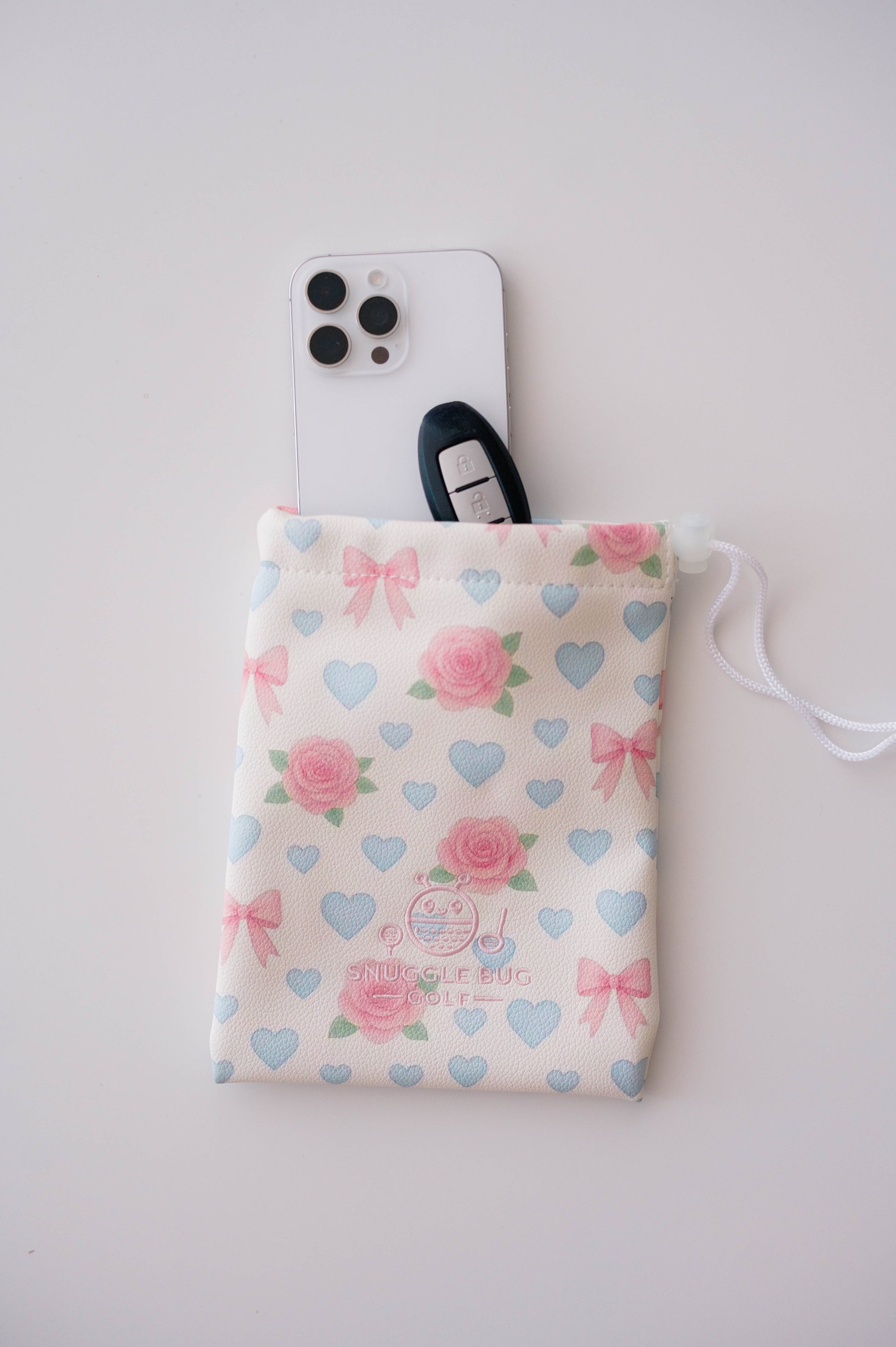 Snuggle Bug Golf Sweetheart Rose drawstring pouch with pink roses, blue hearts, and bows on textured eco-leather.