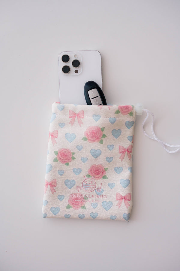 Snuggle Bug Golf Sweetheart Rose drawstring pouch with pink roses, blue hearts, and bows on textured eco-leather.
