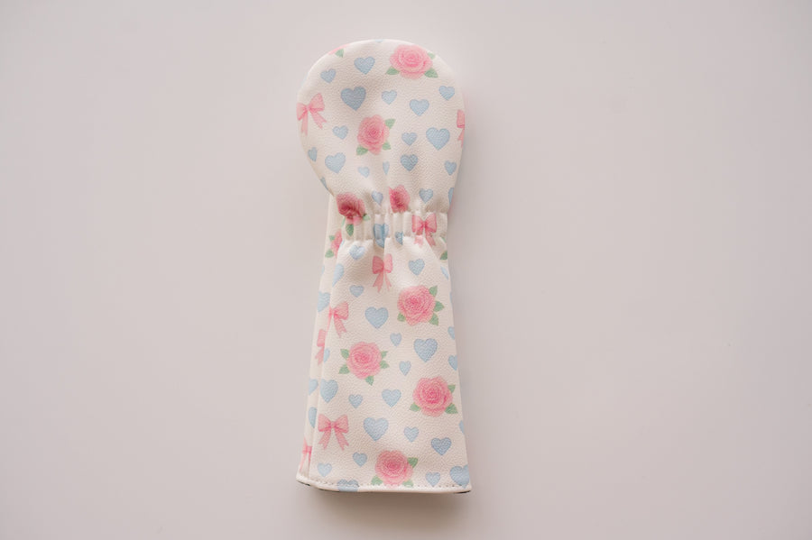Snuggle Bug Golf hybrid headcover in Sweetheart Rose print with pink roses, blue hearts, and blush bows on eco-leather.