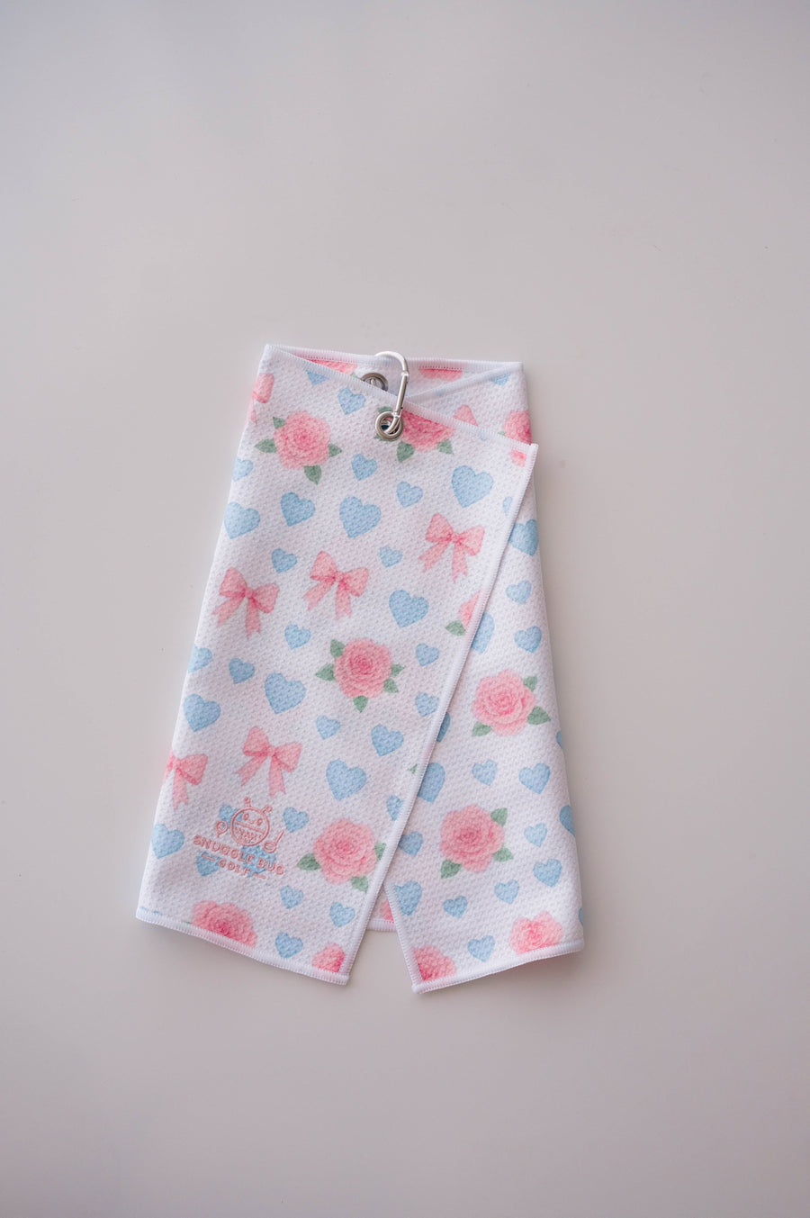 Snuggle Bug Golf Sweetheart Rose microfiber golf towel with pink roses, blue hearts, and bows with a silver hook.