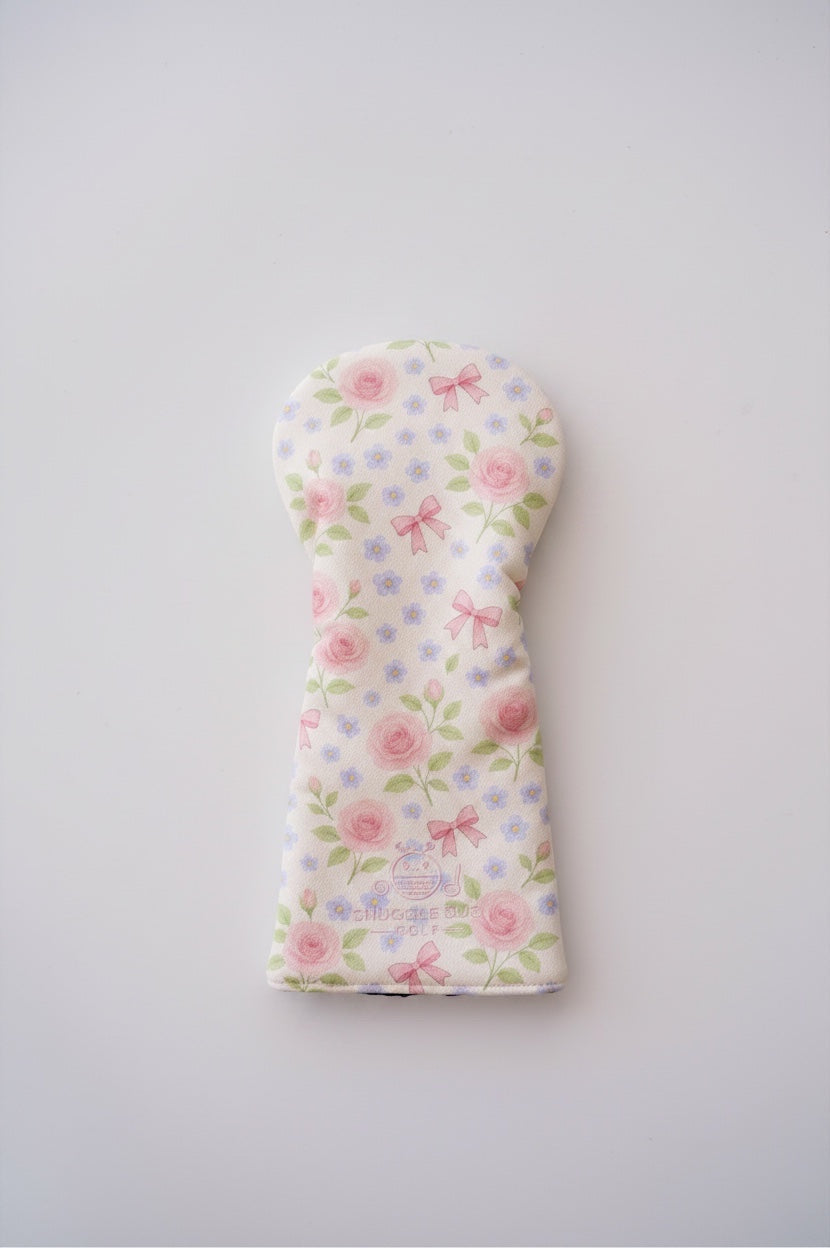 Snuggle Bug Golf Whisper Rose driver head cover in textured eco-leather with pink floral and bow print.