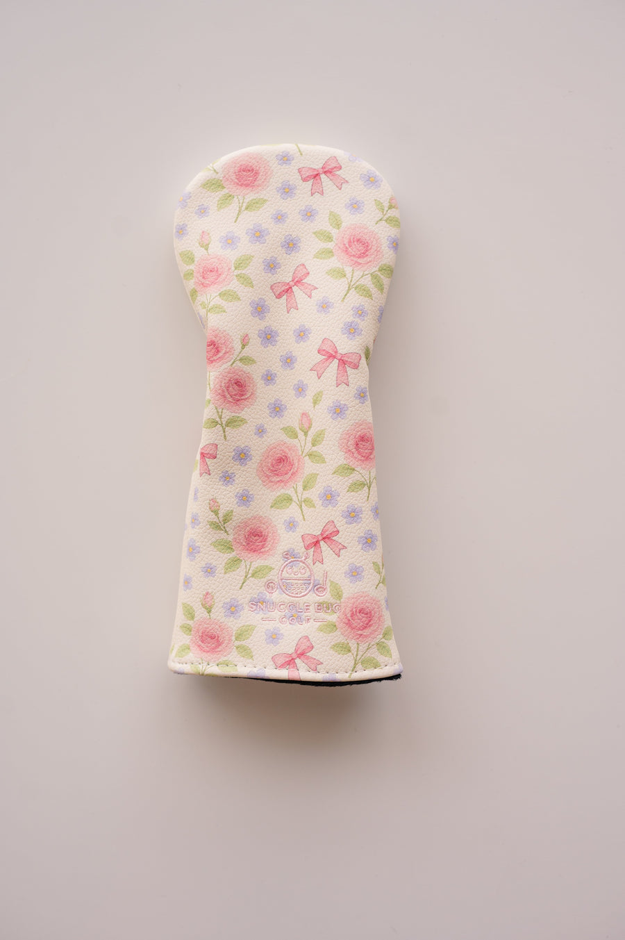 Snuggle Bug Golf Whisper Rose hybrid headcover featuring a blush floral print on textured eco-leather with pink bows.