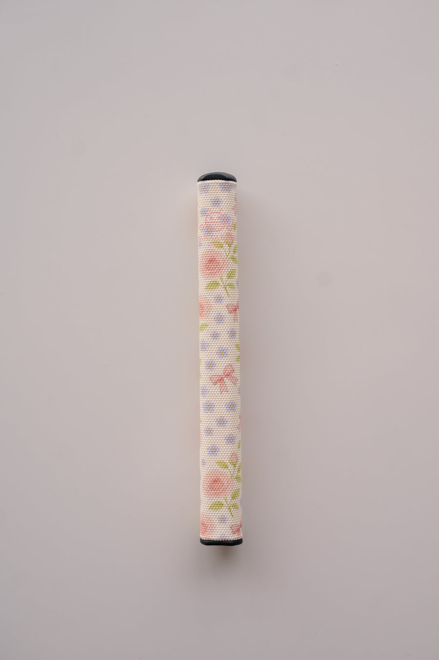 Snuggle Bug Golf Whisper Rose putter grip featuring a delicate floral print with pastel bows on a white EVA surface.