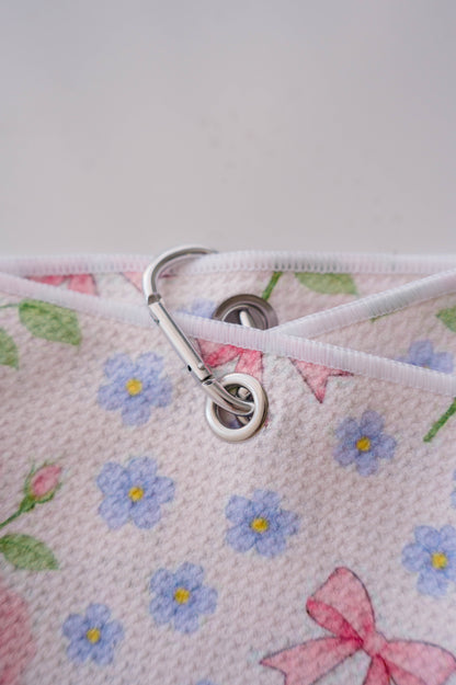 Snuggle Bug Golf Whisper Rose microfiber towel with floral print, silver grommet, and hook attachment.